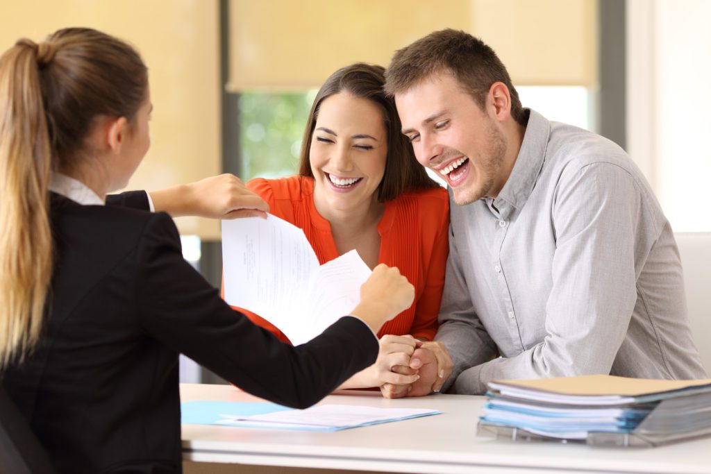 A happy couple buy a new house in Riverside CA