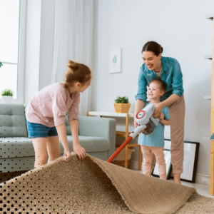 The mother and her kids turning living room chores into a fun activity 